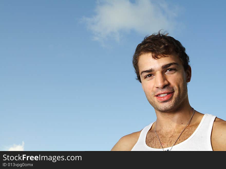 Young man on blue sky