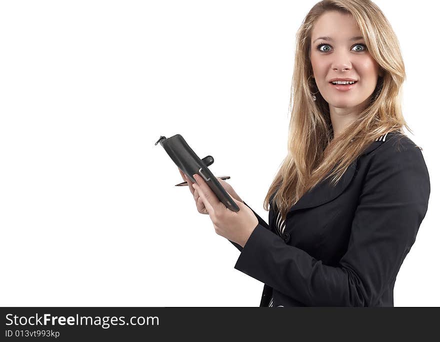 Surprised or shocked beautiful blonde businesswoman wearing office clothes and holding her filofax with a pen. Isolated on white background