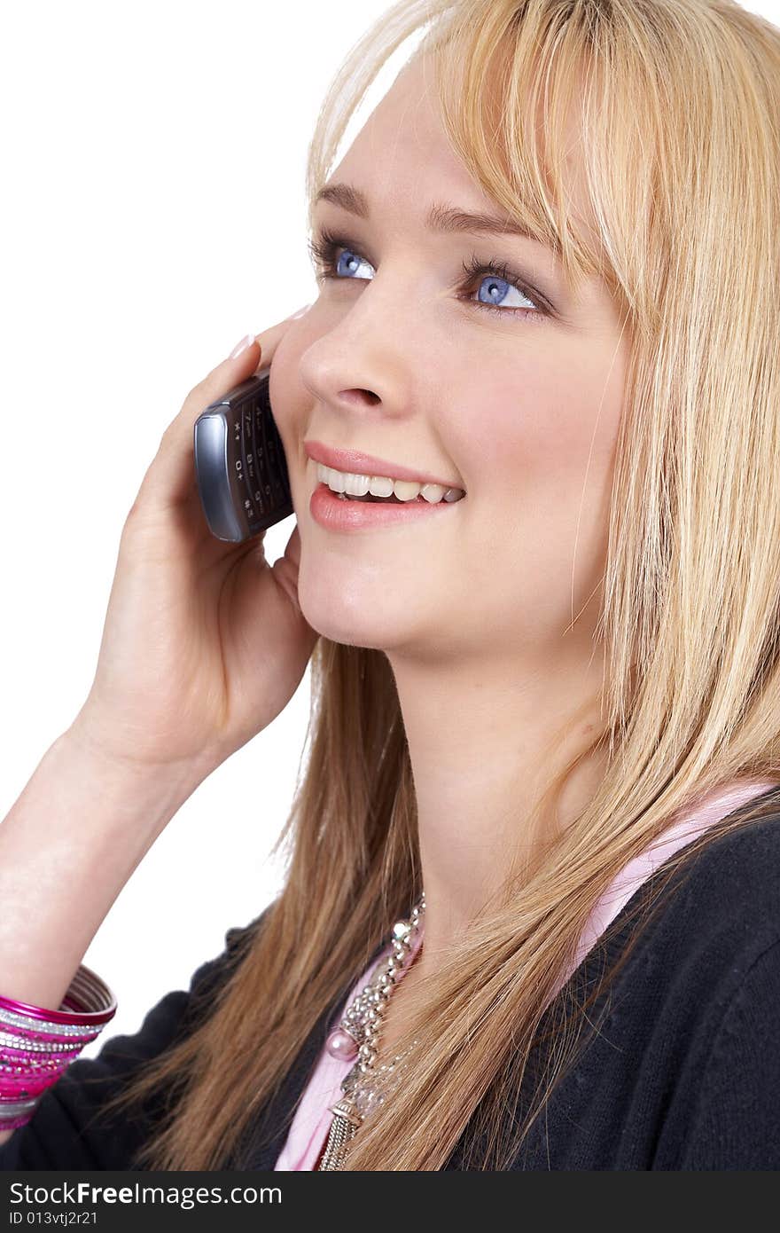 Beautiful blonde businesswoman talking on the cellphone. Isolated on white background. Beautiful blonde businesswoman talking on the cellphone. Isolated on white background