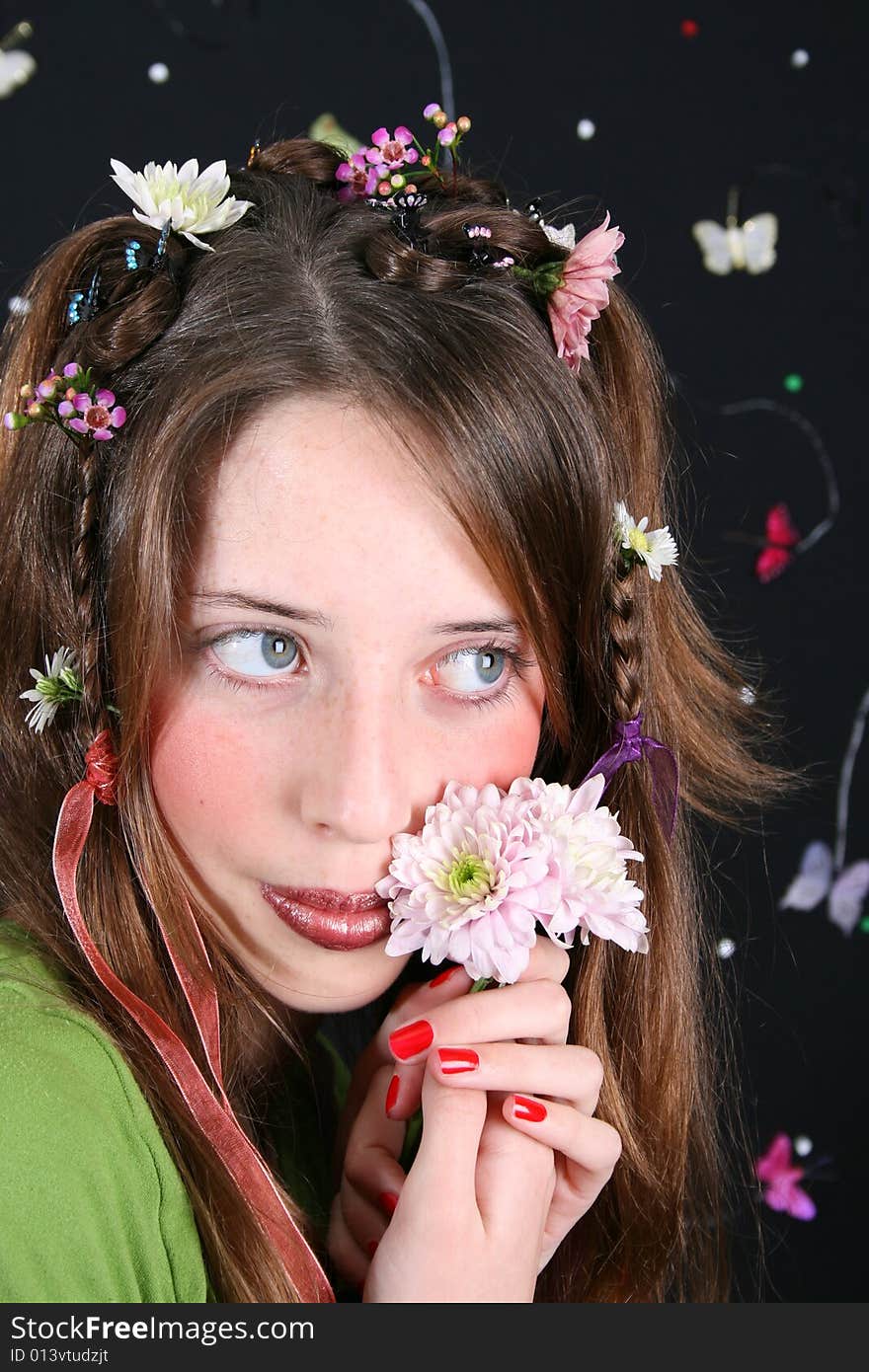 Teenage model with flowers and butterflies in her hair. Teenage model with flowers and butterflies in her hair