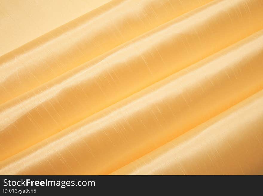 Grunge gold silk fabric textured striped background