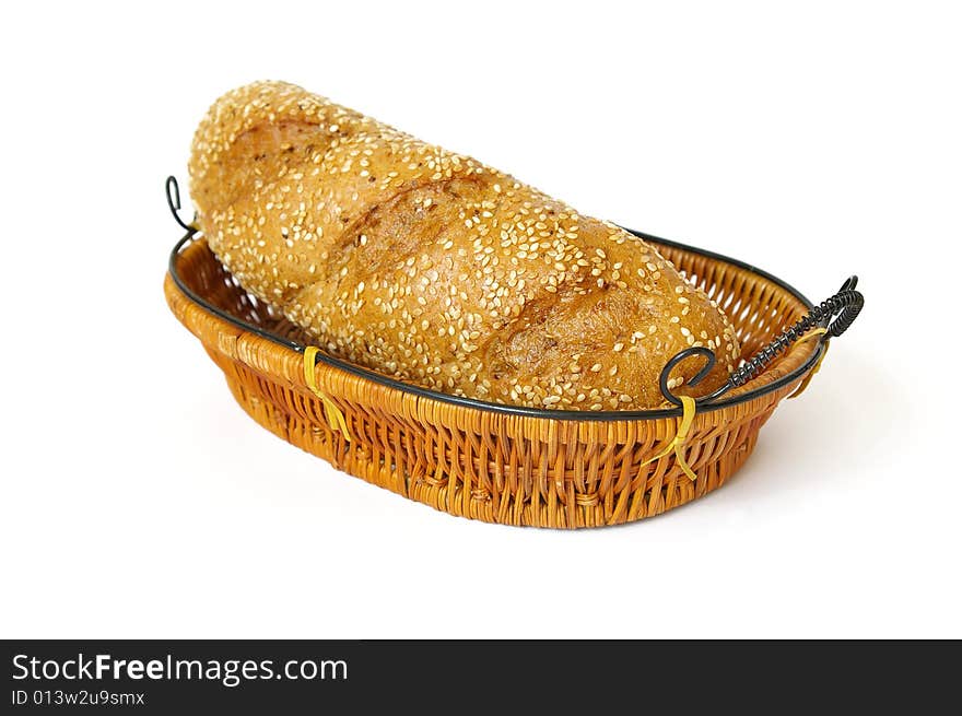 Fresh roll in a basket isolated on a white background. Fresh roll in a basket isolated on a white background