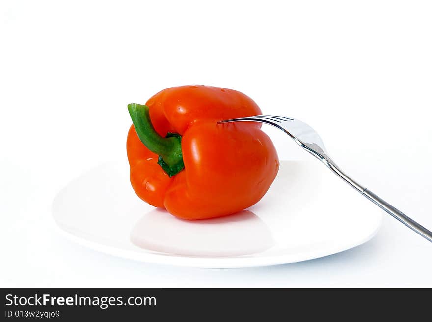 Sweet Pepper And Fork On White