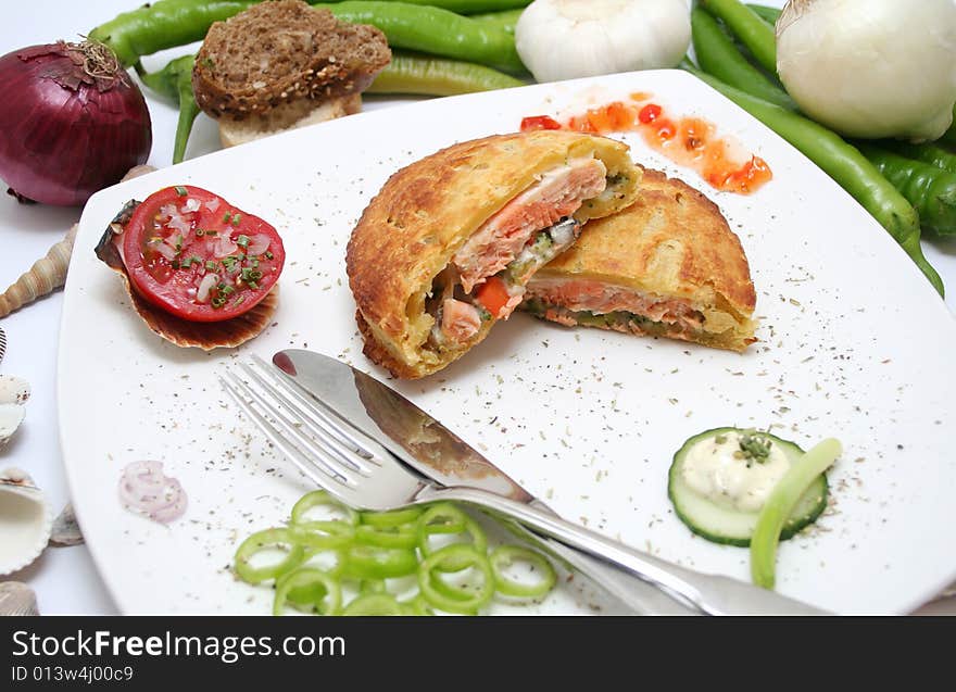 Fresh salmon fish in bread on a plate