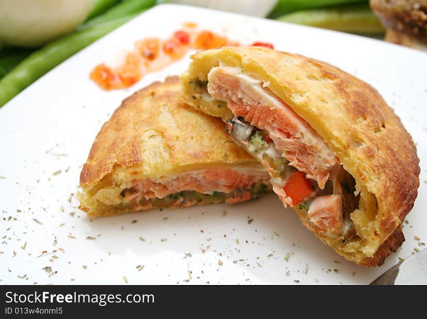 Fresh salmon fish in bread on a plate