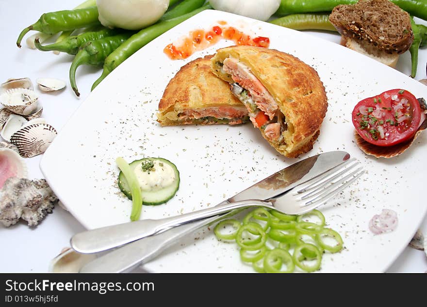 Fresh salmon fish in bread on a plate