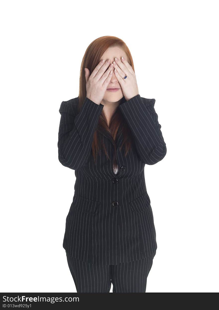 Isolated studio shot of a businesswoman in the See No Evil pose. Isolated studio shot of a businesswoman in the See No Evil pose.