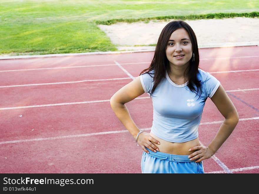 Fit young woman smiling, after exercising. Fit young woman smiling, after exercising.