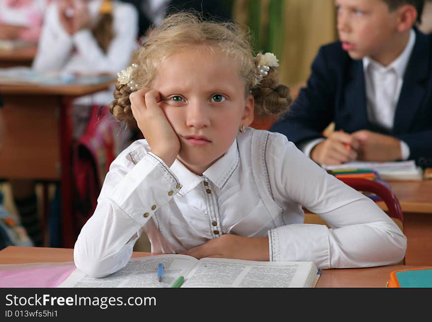 The beautiful girl with two plaits misses at a lesson. The beautiful girl with two plaits misses at a lesson