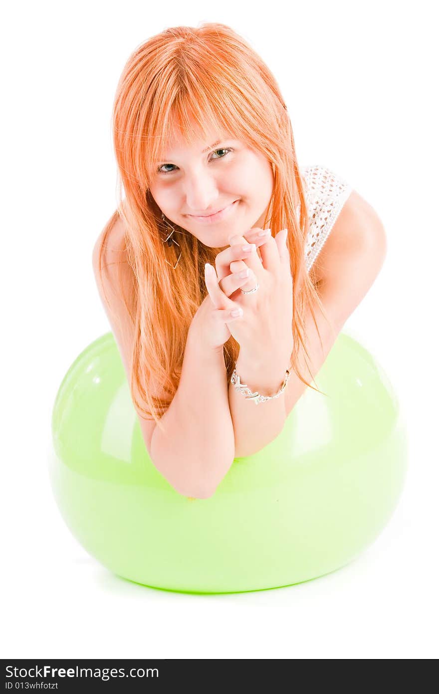 Smiling girl on green ball