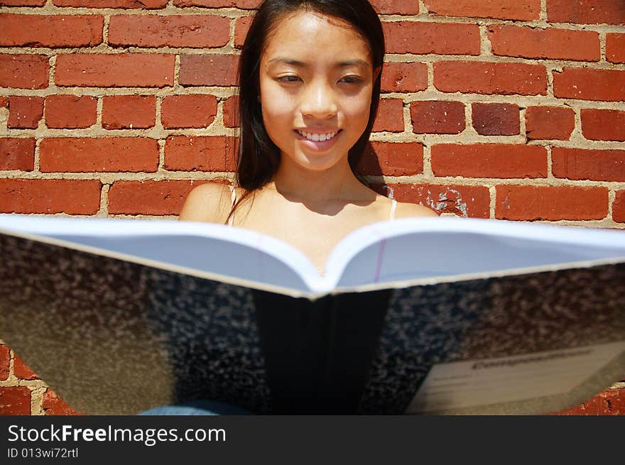 Girl Writing In Note Book