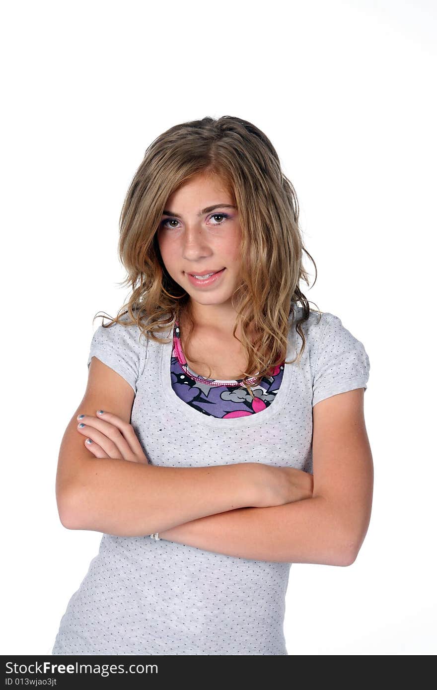 Young girl with arms crossed and layered shirts