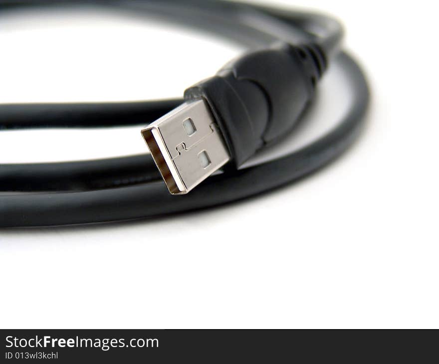 Close-up of black usb cable over white background