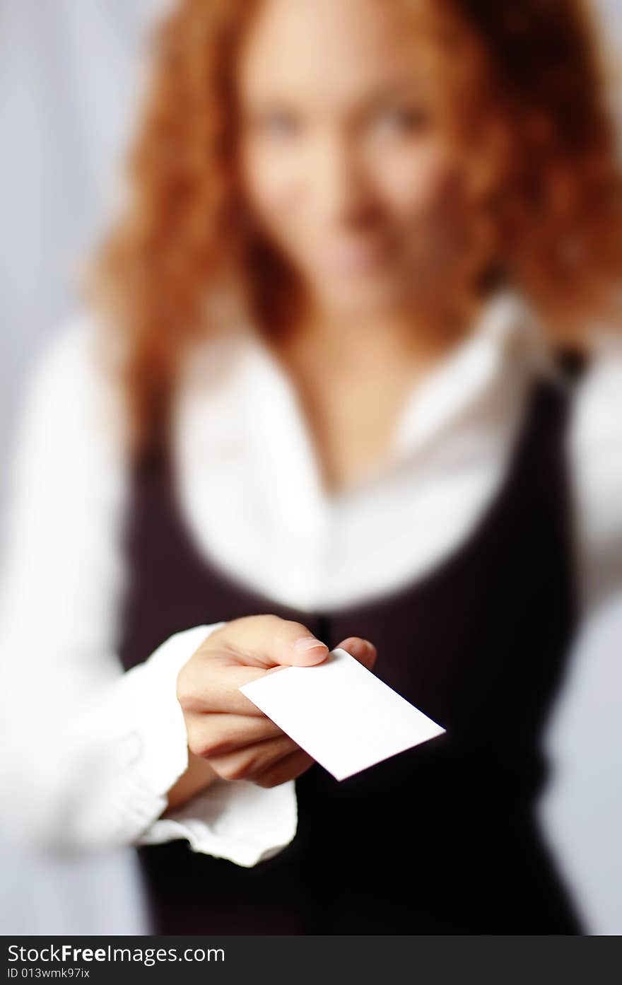 Pretty girl holding white blank media, against white. Pretty girl holding white blank media, against white.