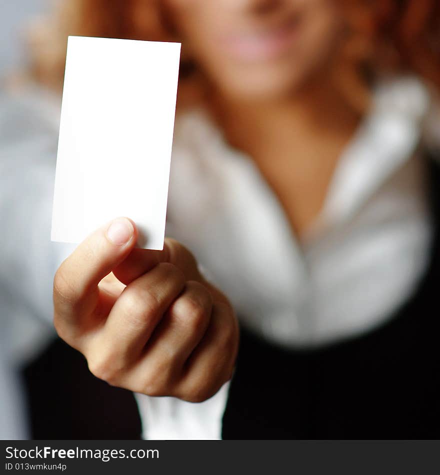 Pretty girl holding white blank media, against white. Pretty girl holding white blank media, against white.