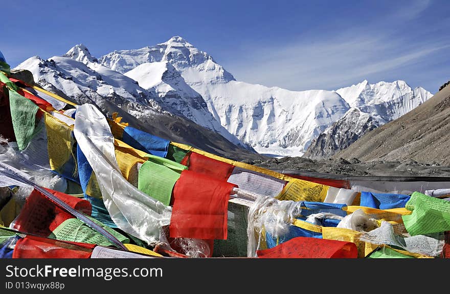 Sutra streamers and Mount Qomolangma in blue sky