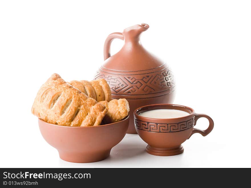 Pie, jug and cup of milk