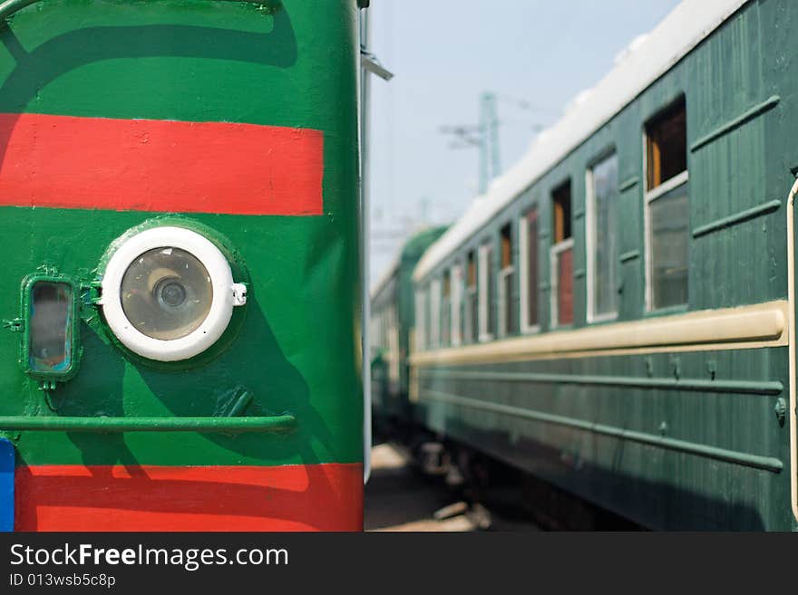 Locomotive and wagon on railroad station