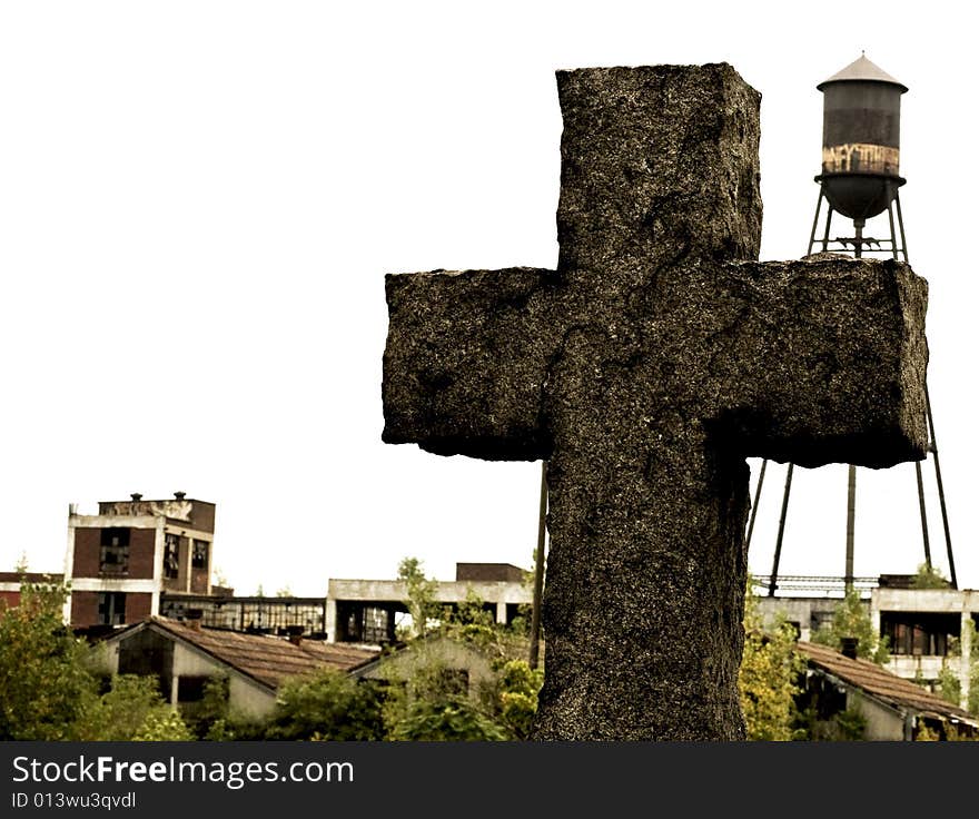 Picture of a stone cross in a cemetery with a run down factory and water tower in the background. Picture of a stone cross in a cemetery with a run down factory and water tower in the background