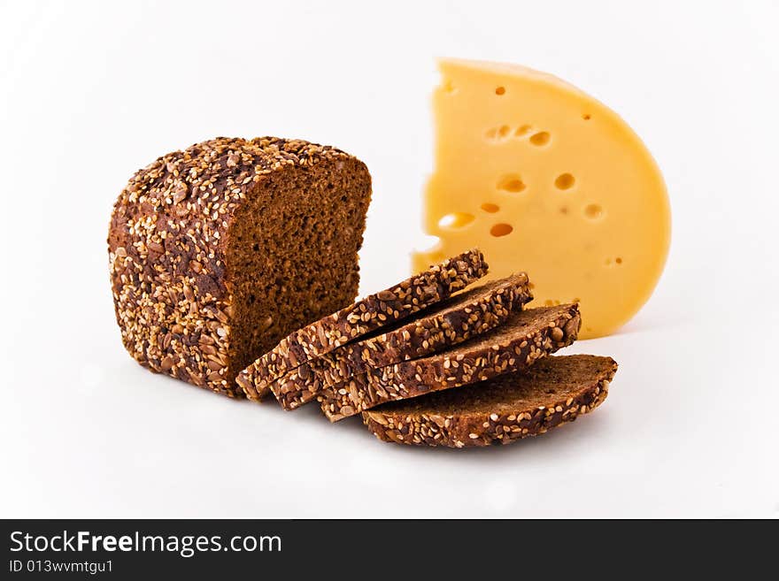 Appetizing bread and cheese on white background