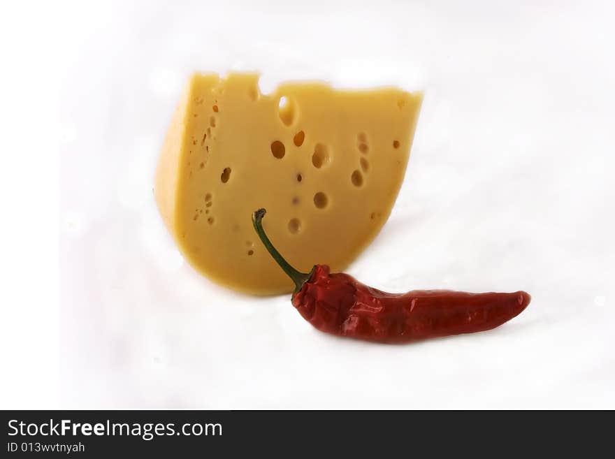 Cheese and pepper upon white background. Cheese and pepper upon white background