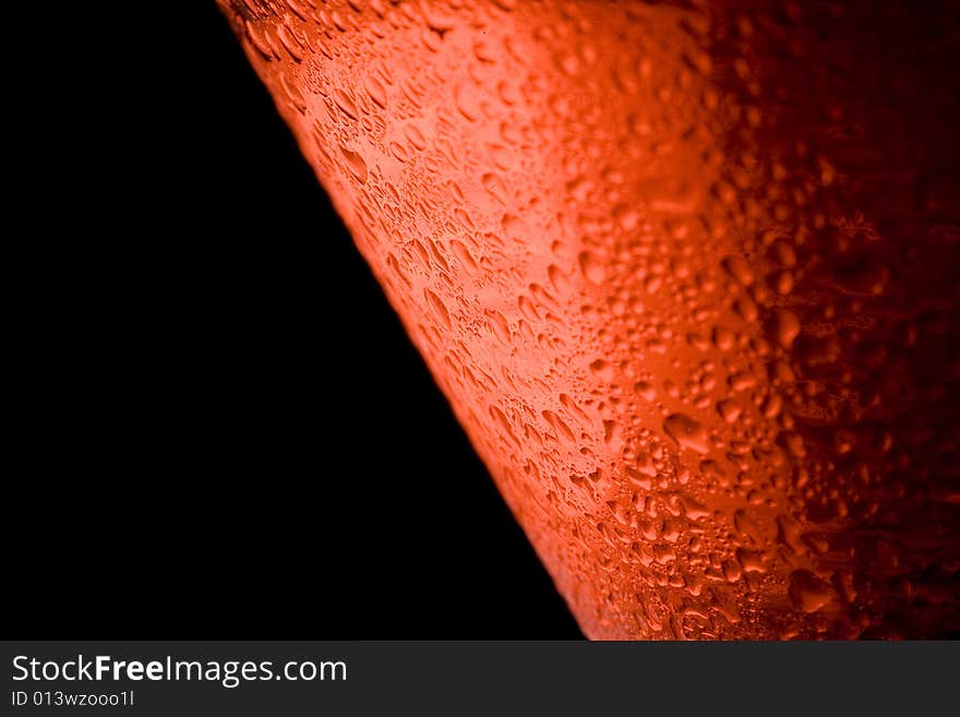 Closeup of moisture on a cosmopolitan glass with a black background