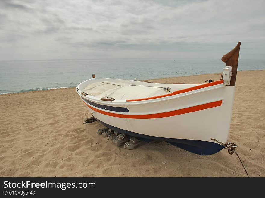 Fishing boat docked by the beach. Fishing boat docked by the beach