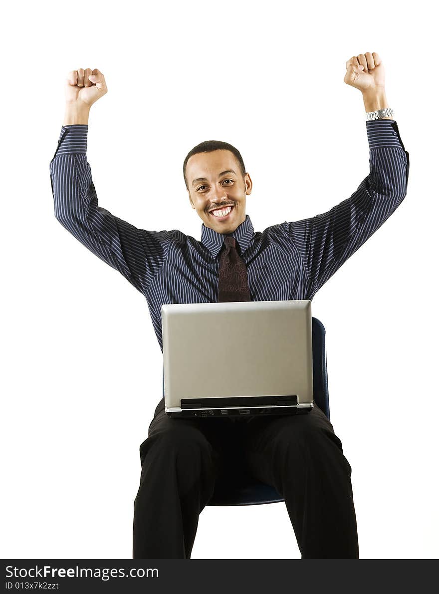 A young professional African-American male working on a laptop. A young professional African-American male working on a laptop.