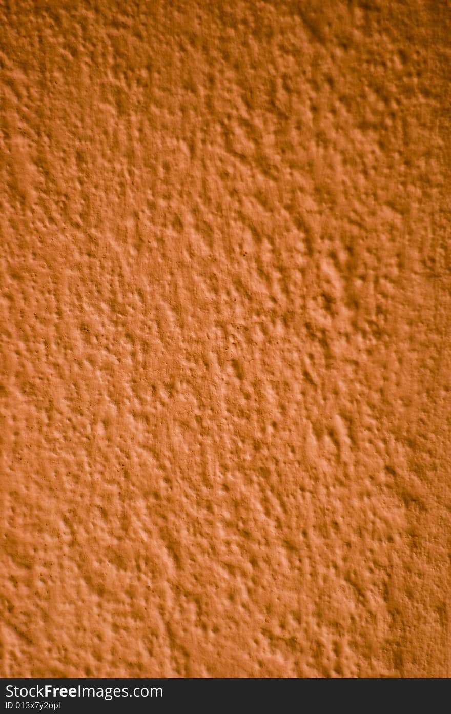 Detail of a red painted rough wall texture. Detail of a red painted rough wall texture