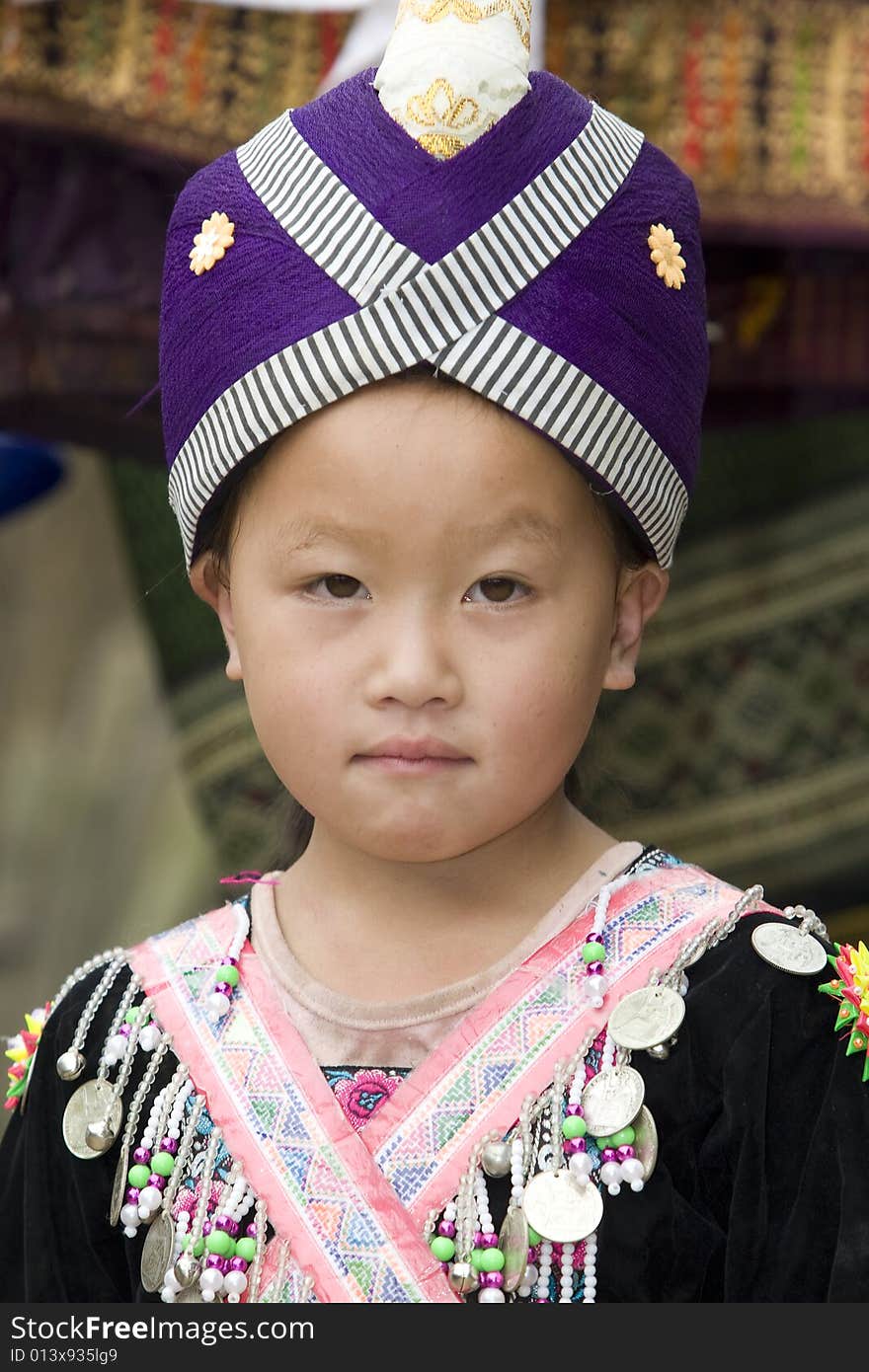 Laos Hmong girl in traditional clothes in the surroundings of Luang Prabang