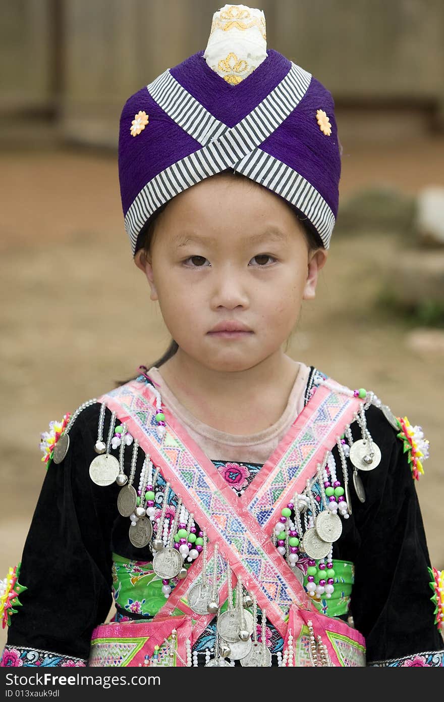 Laos Hmong girl in traditional clothes in the surroundings of Luang Prabang