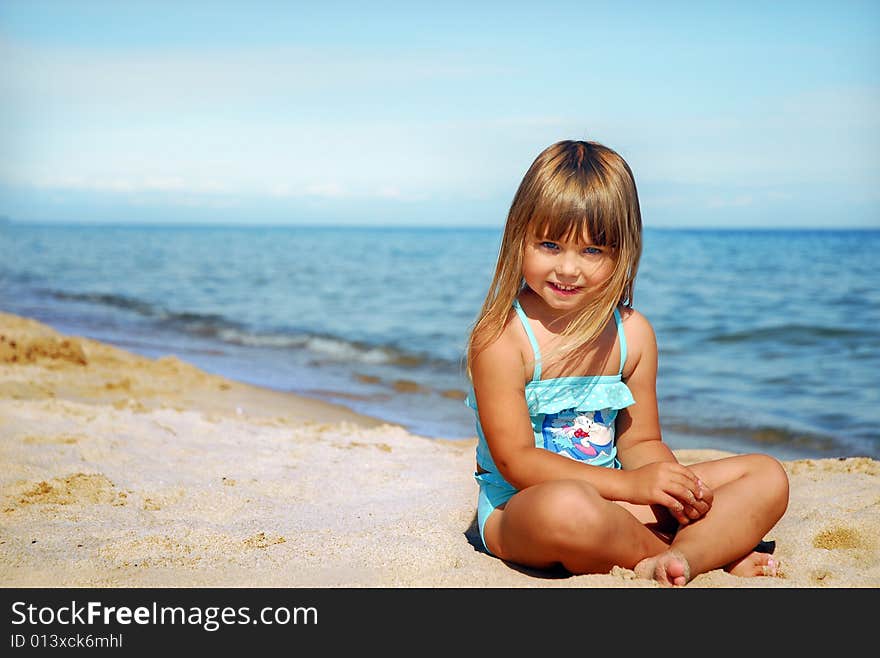 Little cute girl on the beach