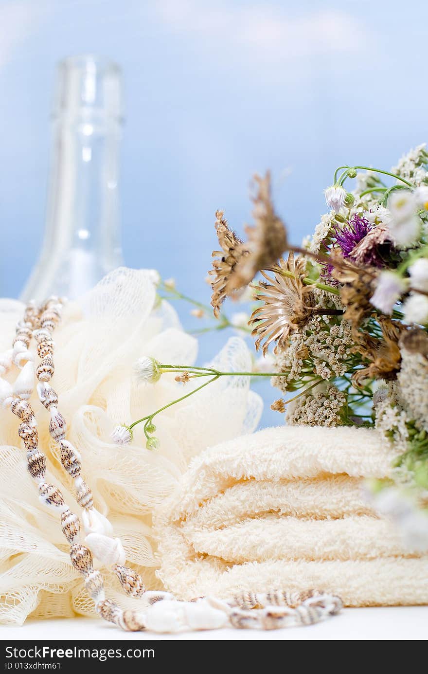 Bath background with towel, sponge and bottles