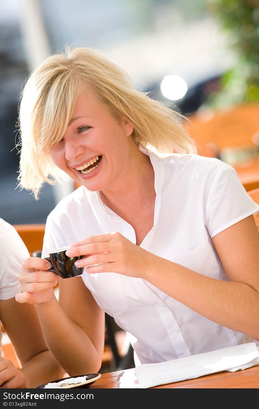 Lovely young girl with cup of coffee