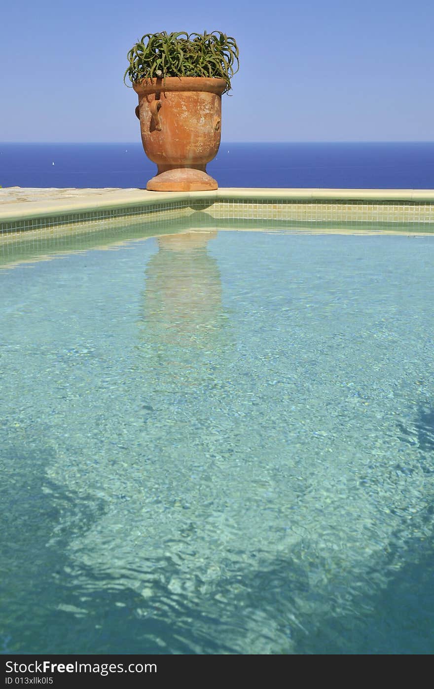 A beautiful pool at the edge of the Mediterranean to Spain