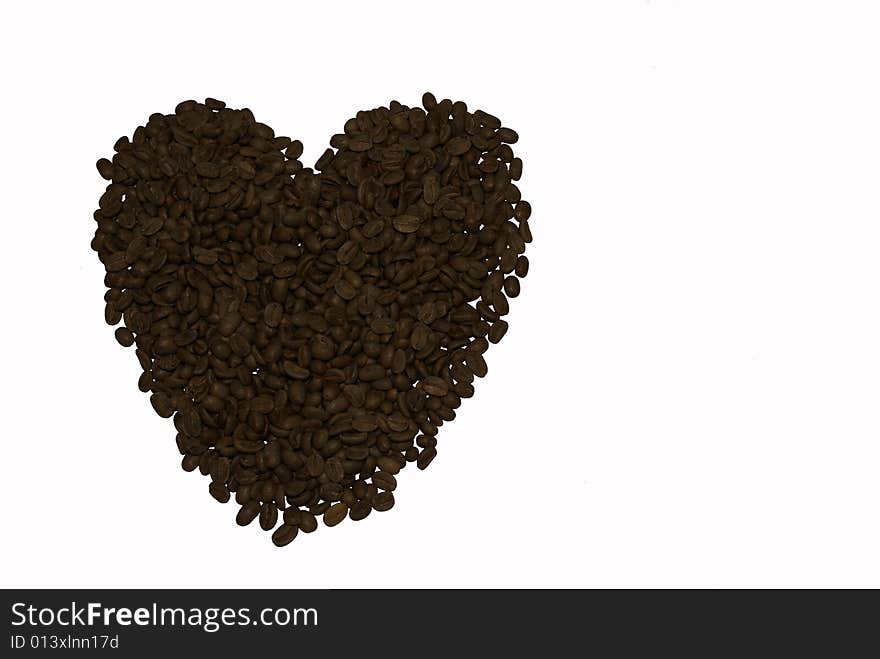 Heart from brown grains of coffee. Heart from brown grains of coffee