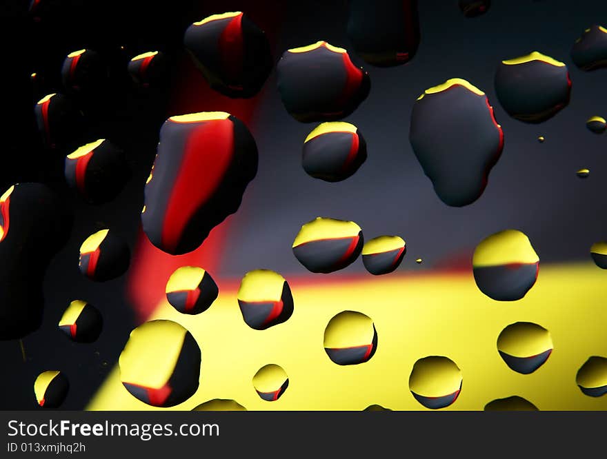 Water drops on glass with a multi-coloured background