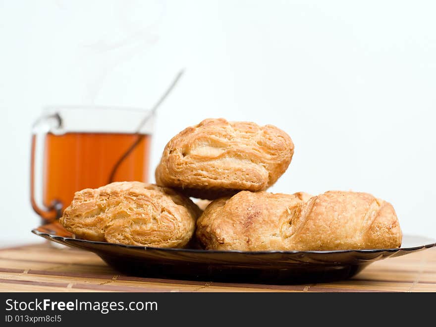 Baked tasty cakes and cup of tea. Baked tasty cakes and cup of tea