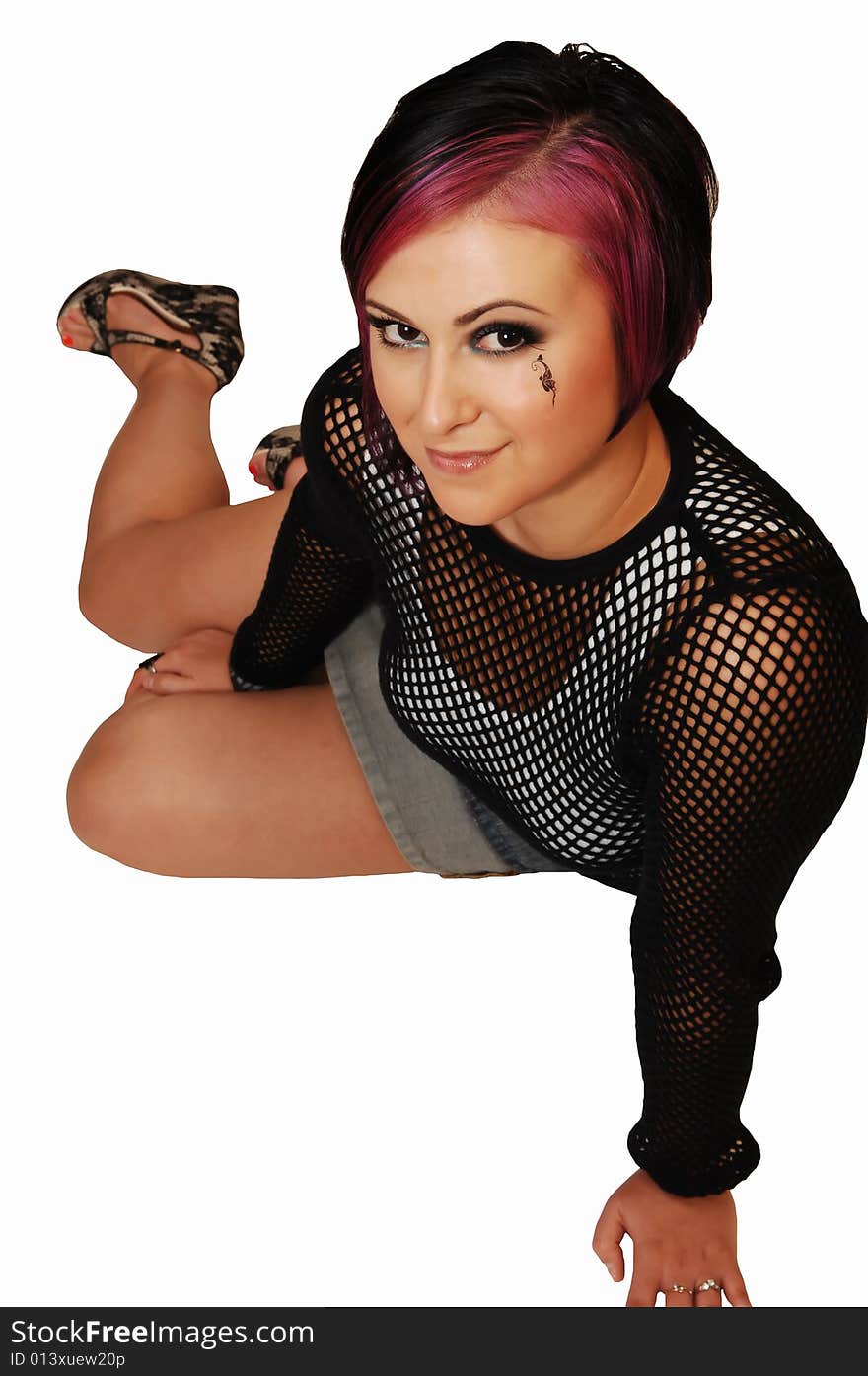 A young pretty woman sitting on the floor in a studio and having fun taking
pictures from the front for white background. A young pretty woman sitting on the floor in a studio and having fun taking
pictures from the front for white background.