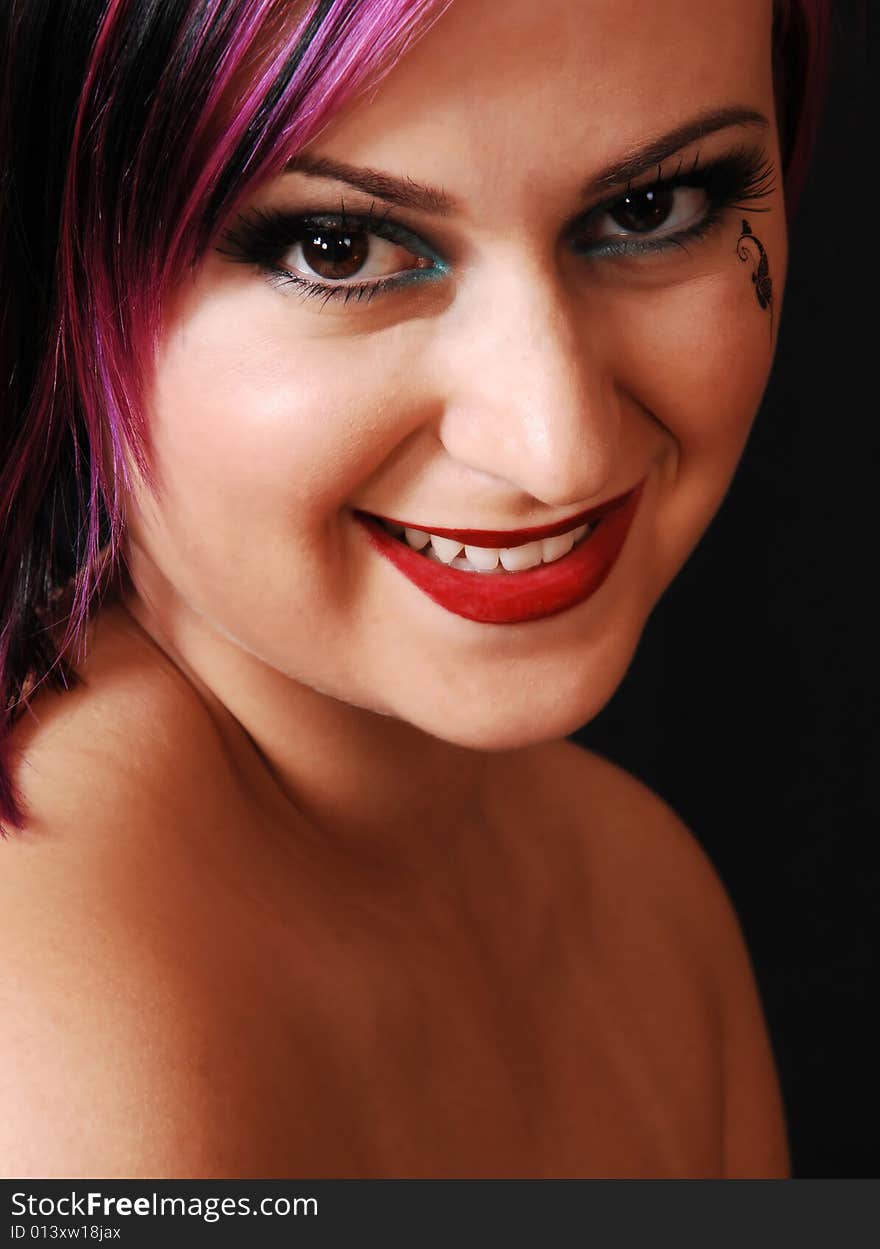 An close up heath shot of a lovely, beautiful young woman with a
black butterfly on her cheek. An close up heath shot of a lovely, beautiful young woman with a
black butterfly on her cheek.