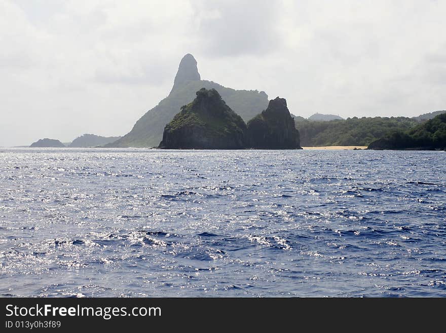 Silhouette of the Two Brother on the foerground and Pico Mount in the background at Fernando de Noronha. Silhouette of the Two Brother on the foerground and Pico Mount in the background at Fernando de Noronha