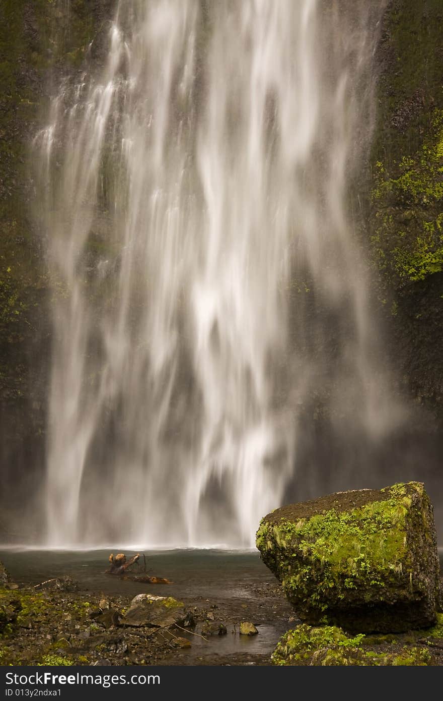 Waterfall with rocks and pond