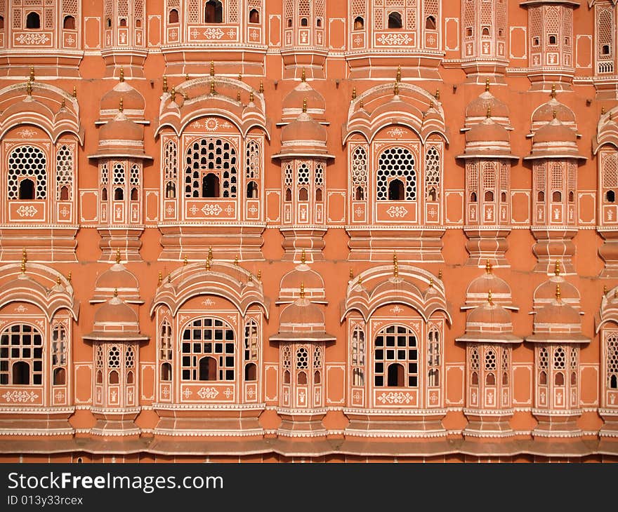 Palace in Jaipur, India. It was built in 1799 by Maharaja Sawai Pratap Singh, and designed by Lal Chand Usta in the form of the crown of Krishna, the Hindu god. It forms part of the City Palace and extends the Zenana or women's chambers, the chambers of the harem. Its original intention was to allow royal ladies to observe everyday life in the street below without being seen. Palace in Jaipur, India. It was built in 1799 by Maharaja Sawai Pratap Singh, and designed by Lal Chand Usta in the form of the crown of Krishna, the Hindu god. It forms part of the City Palace and extends the Zenana or women's chambers, the chambers of the harem. Its original intention was to allow royal ladies to observe everyday life in the street below without being seen.