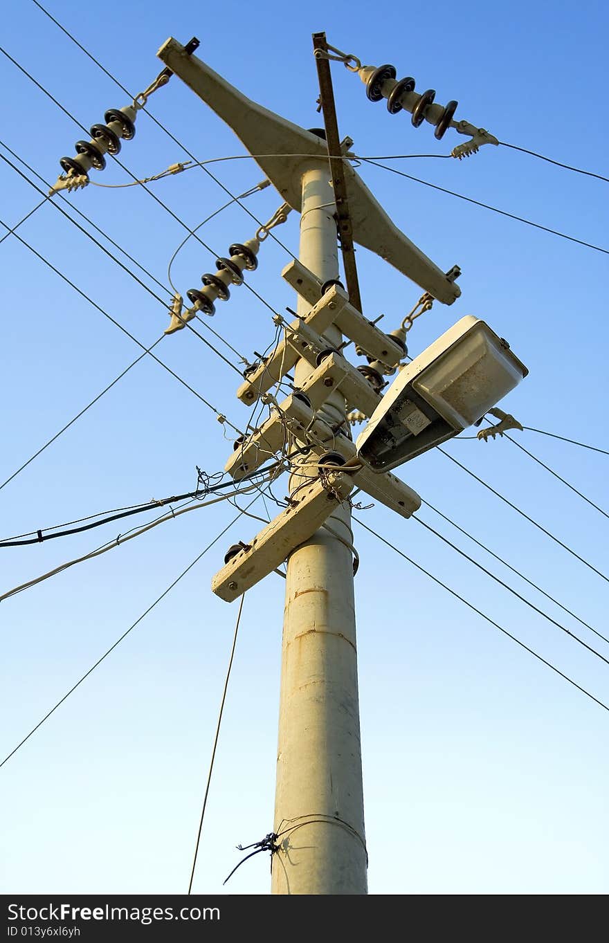 A dangerously manufactured electric pole with a street lamp. A dangerously manufactured electric pole with a street lamp.