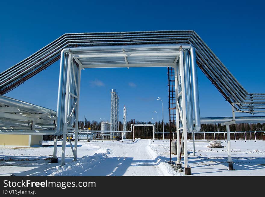 Industrial zone, Steel pipe-lines on blue sky