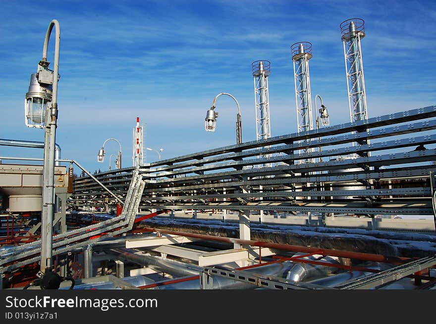 Industrial zone, Steel pipe-lines on blue sky