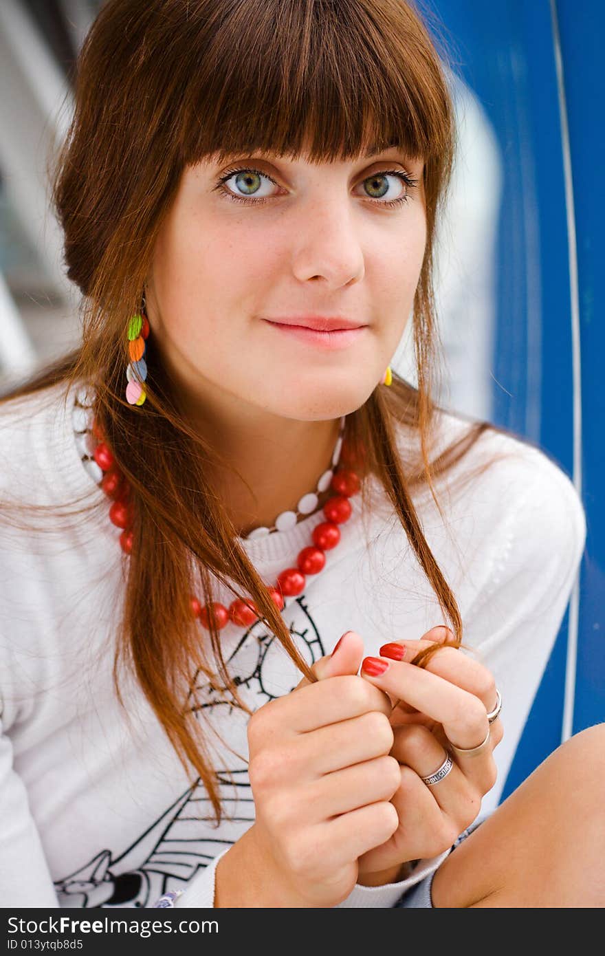 Young surprised girl in red necklace. Young surprised girl in red necklace