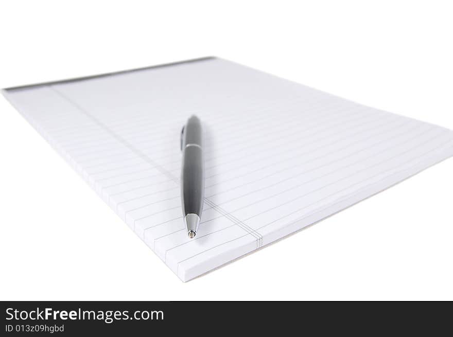 Notepad and a black pen isolated on white. Notepad and a black pen isolated on white