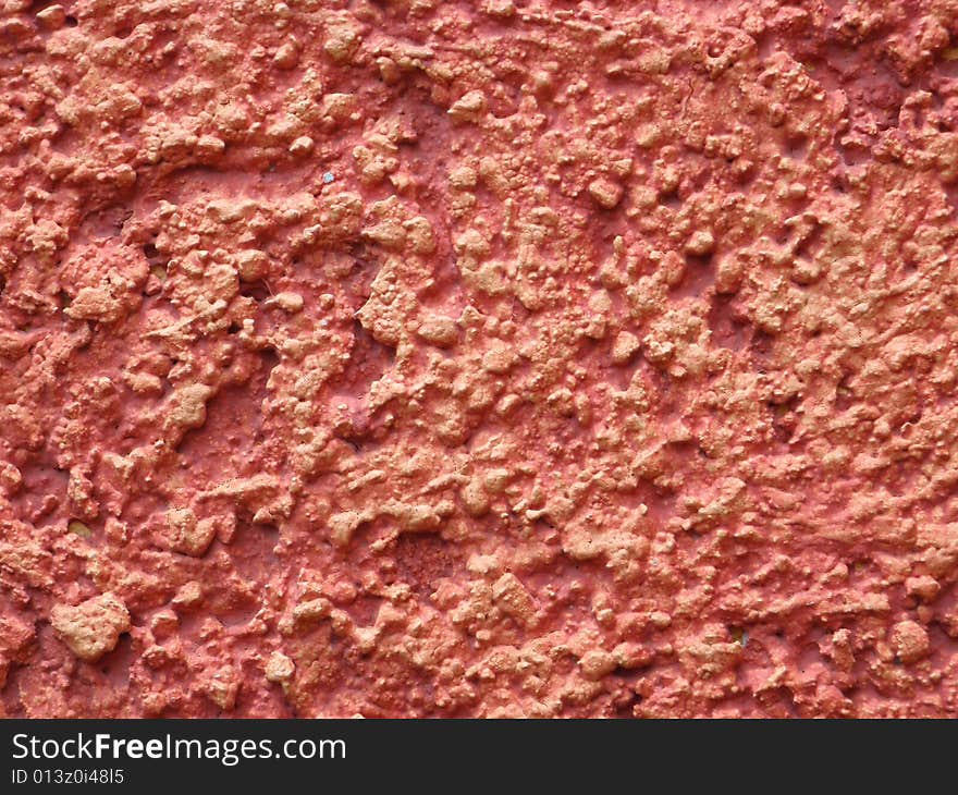 Closeup of a red plastered wall. Closeup of a red plastered wall.