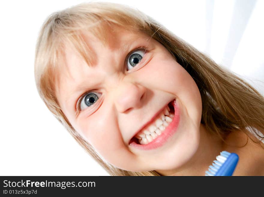 An image of little girl with toothbrush on neutral background. An image of little girl with toothbrush on neutral background